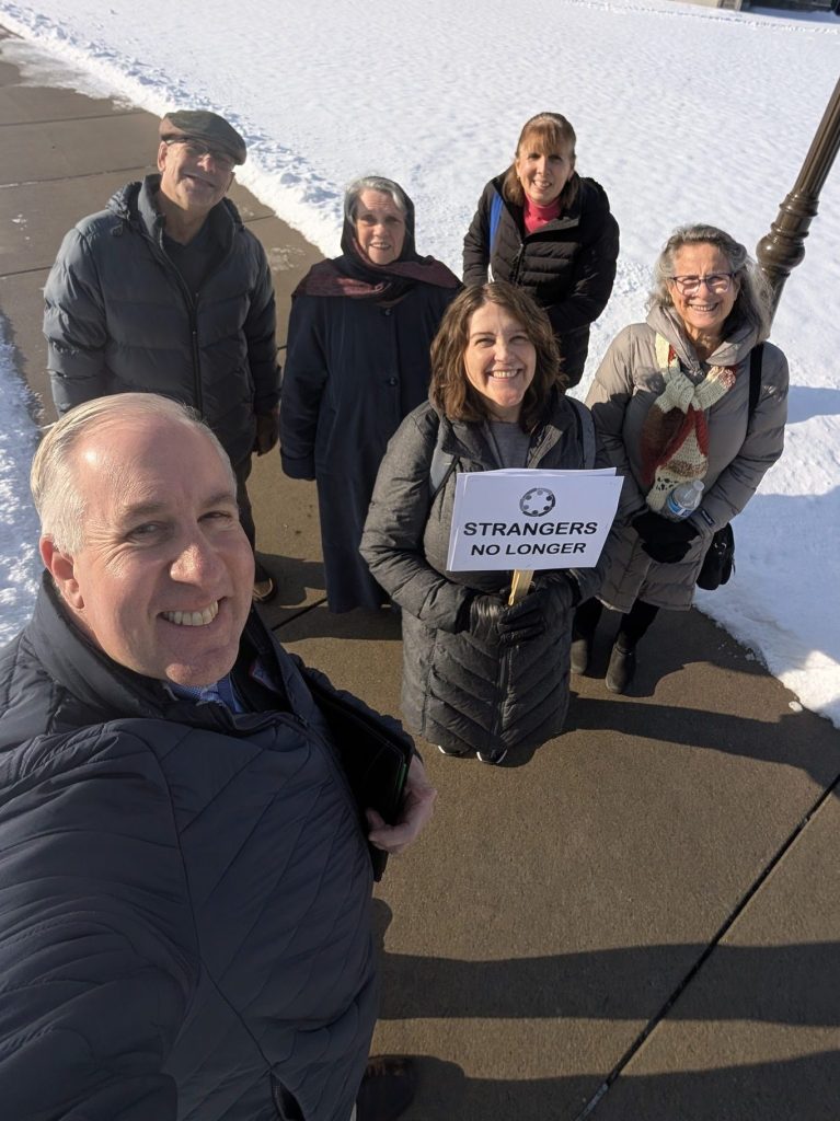 Strangers No Longer members at the Michigan State Capitol in the snow